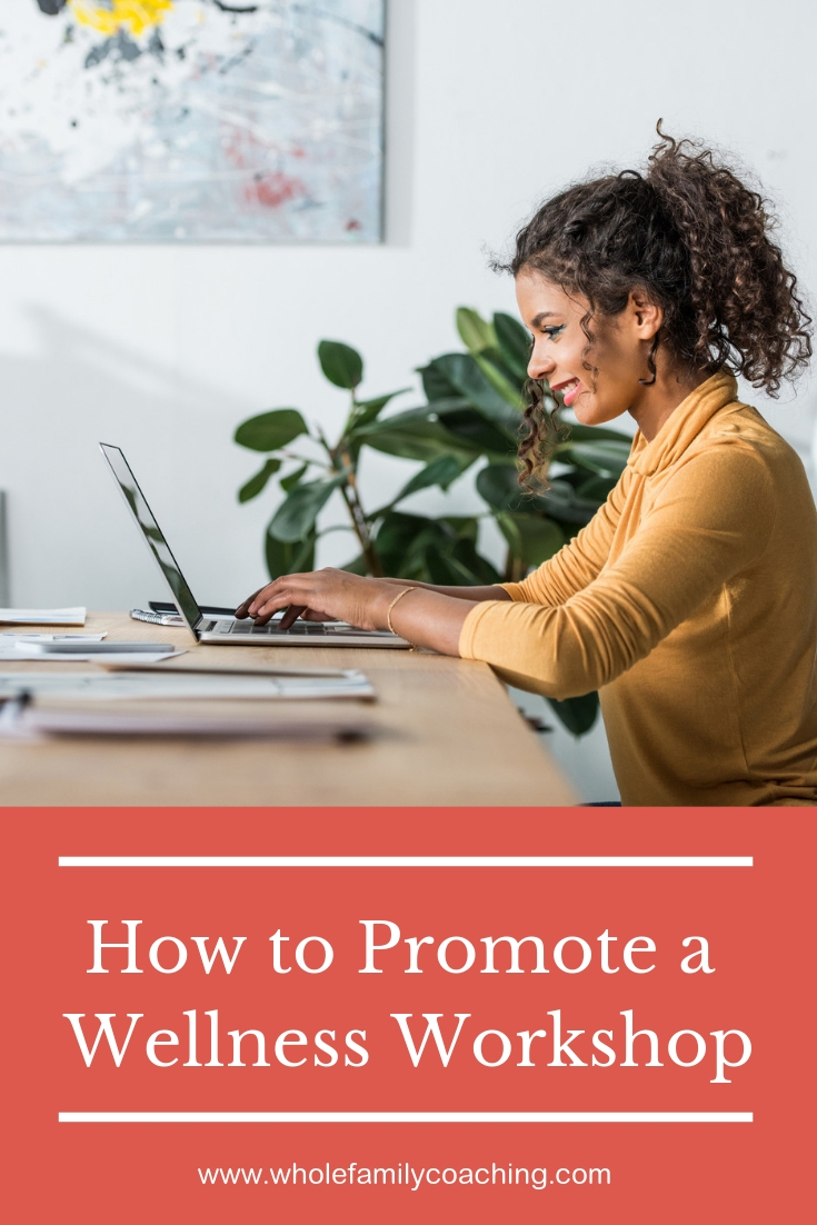Steps to Promote a Wellness Workshop - Whole Family Coaching. Woman sitting at a desk typing on a laptop.